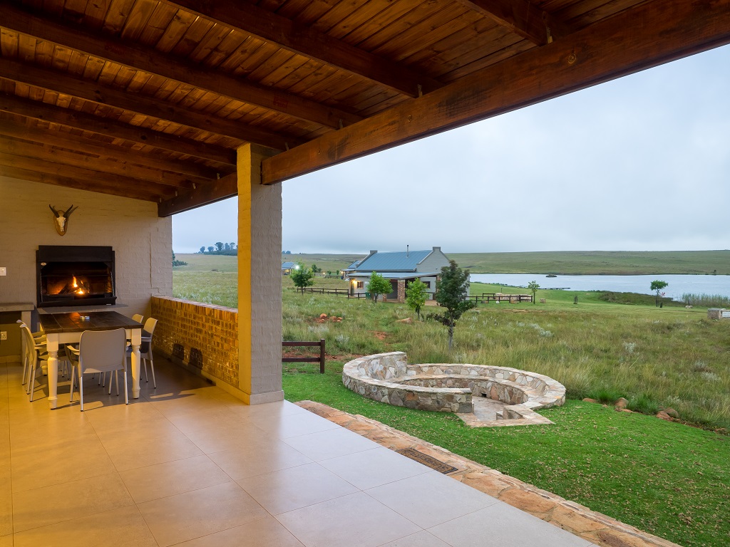 Built in braai area on patio and dining area. Stone boma